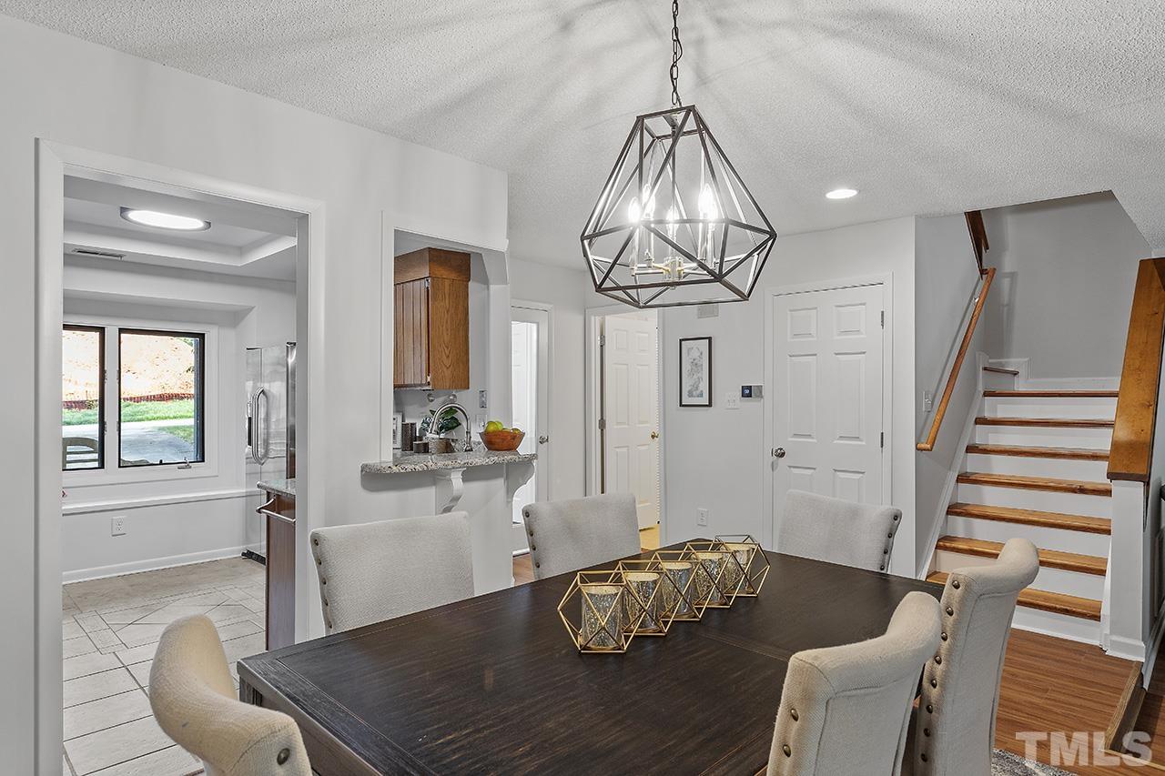 4327 Southwind Drive Raleigh, NC 27613 - Photo 8 of 33 a living room with furniture chandelier and a chandelier