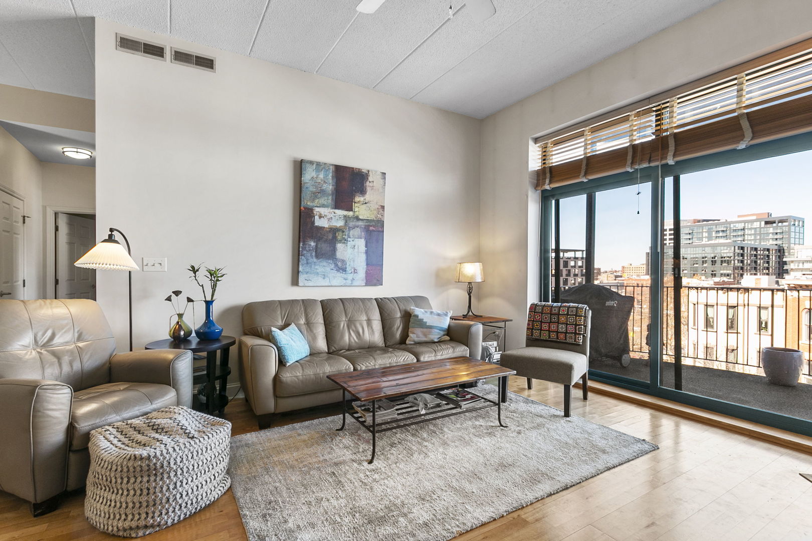 1301 West Washington Boulevard, Unit 508 Chicago, IL 60607 - Photo 8 of 17 a living room with furniture and a window
