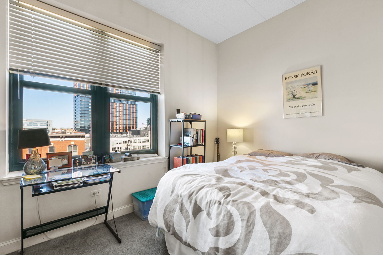 1301 West Washington Boulevard, Unit 508 Chicago, IL 60607 - Photo 10 of 17 a large bedroom with a bed and a large window