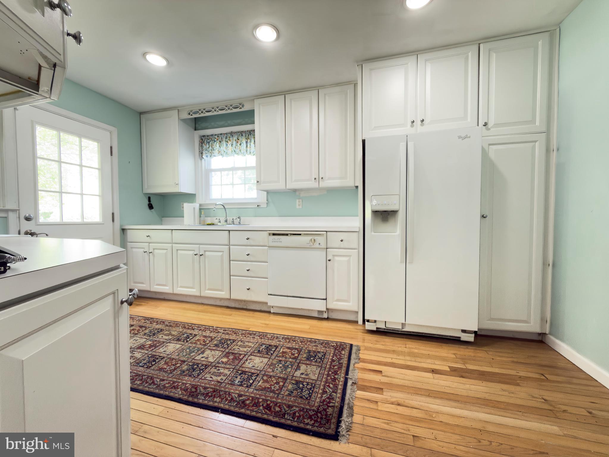 1522 James Road Wynnewood, PA 19096 - Photo 7 of 21 a large kitchen with stainless steel appliances granite countertop a sink stove and refrigerator