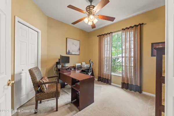 a bedroom with furniture and a flat screen tv