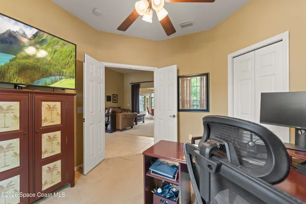 a view of a livingroom with furniture and a window