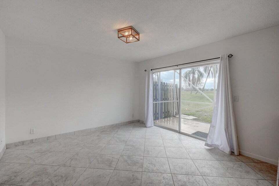 10758 Lake Jasmine Drive Boca Raton, FL 33498 - Photo 11 of 34 a view of an empty room with a window