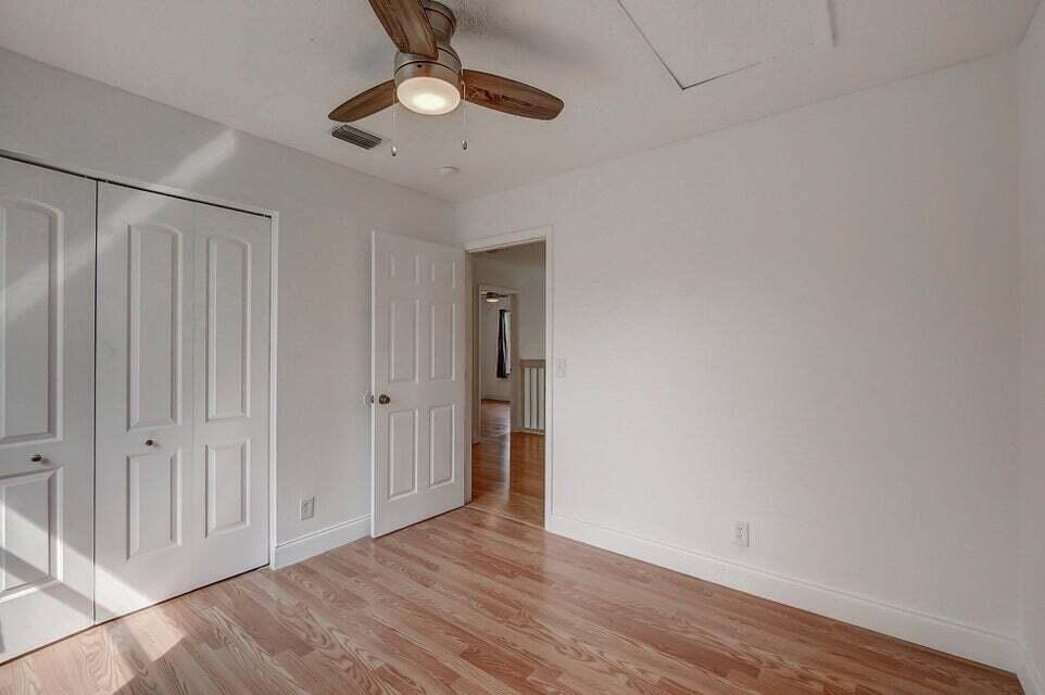 10758 Lake Jasmine Drive Boca Raton, FL 33498 - Photo 15 of 34 wooden floor in an empty room