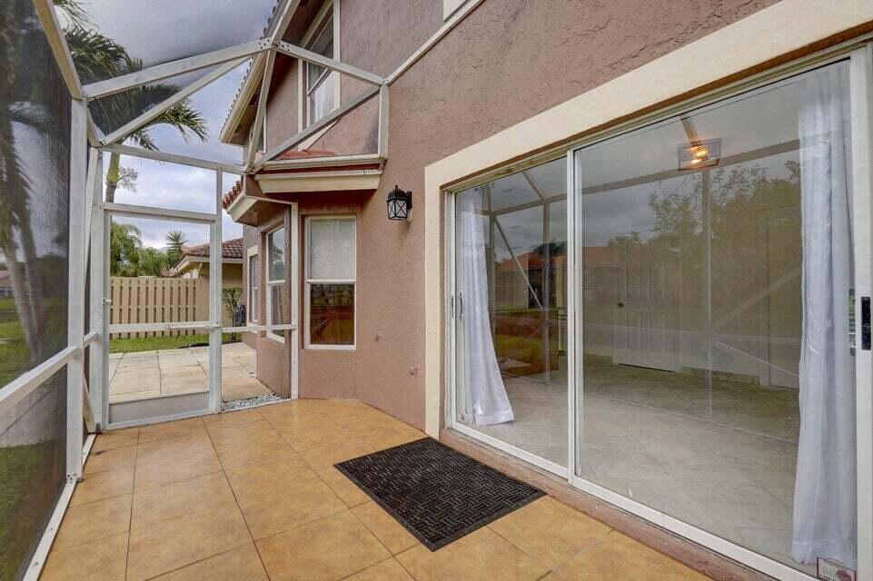 10758 Lake Jasmine Drive Boca Raton, FL 33498 - Photo 27 of 34 a view of a porch