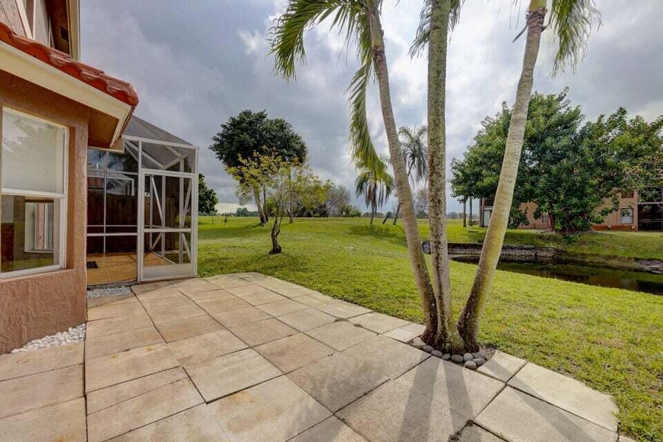 10758 Lake Jasmine Drive Boca Raton, FL 33498 - Photo 29 of 34 a view of a backyard
