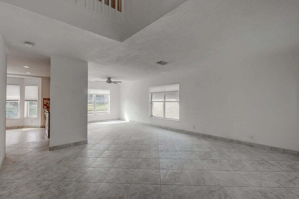 10758 Lake Jasmine Drive Boca Raton, FL 33498 - Photo 7 of 34 a view of an empty room and window