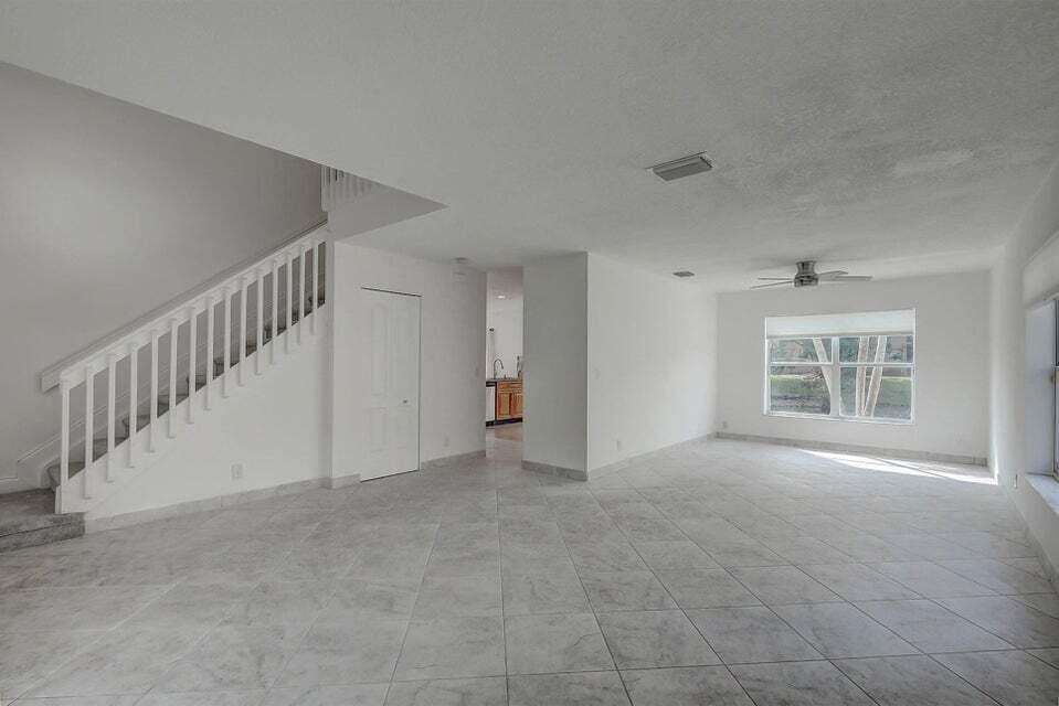 10758 Lake Jasmine Drive Boca Raton, FL 33498 - Photo 8 of 34 a view of an empty room with a window