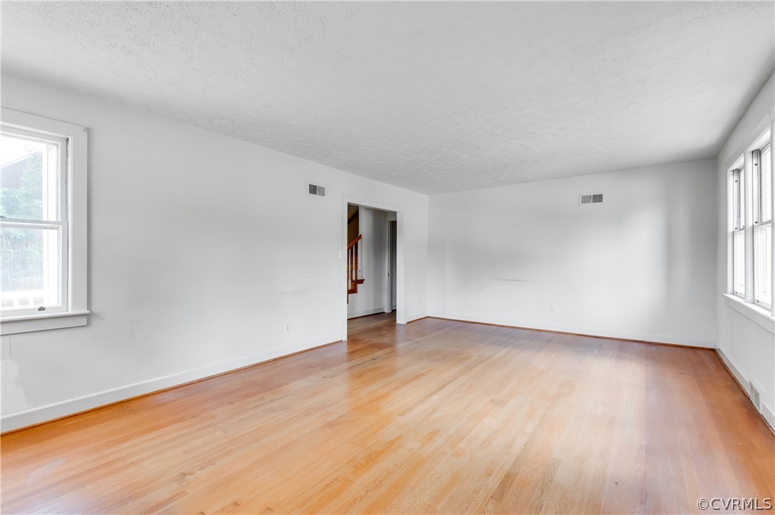 3400 Osborne Road Chester, VA 23831 - Photo 8 of 48 an empty room with wooden floor and windows