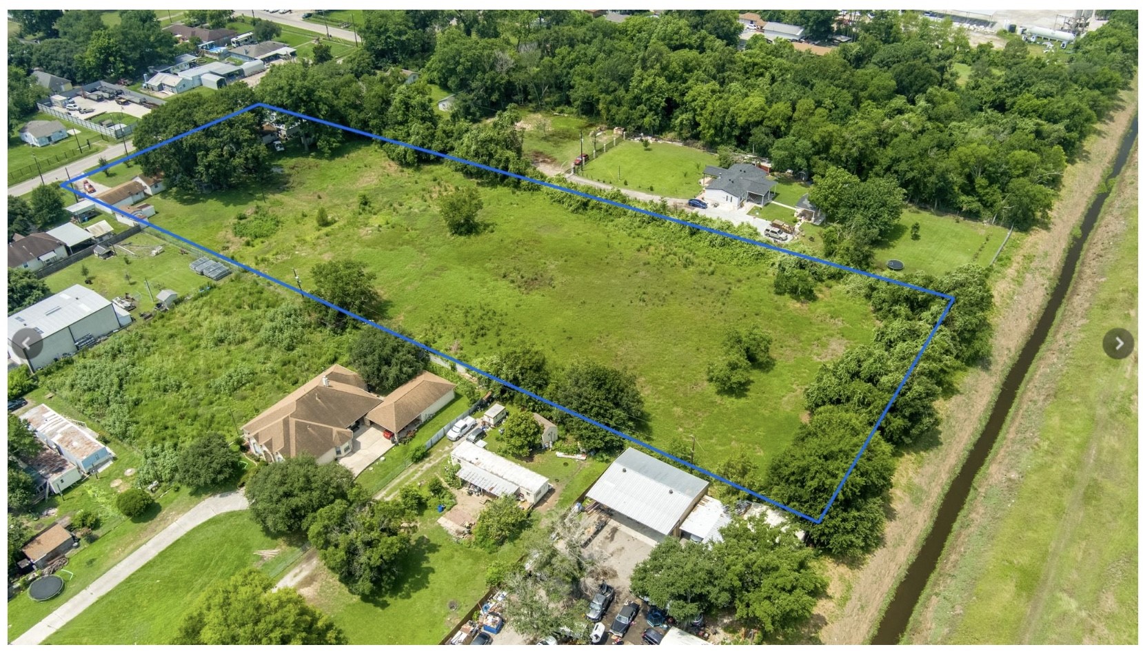 3240 Brownie Campbell Road Houston, TX 77086 - Photo 3 of 19 an aerial view of residential houses with outdoor space and trees all around