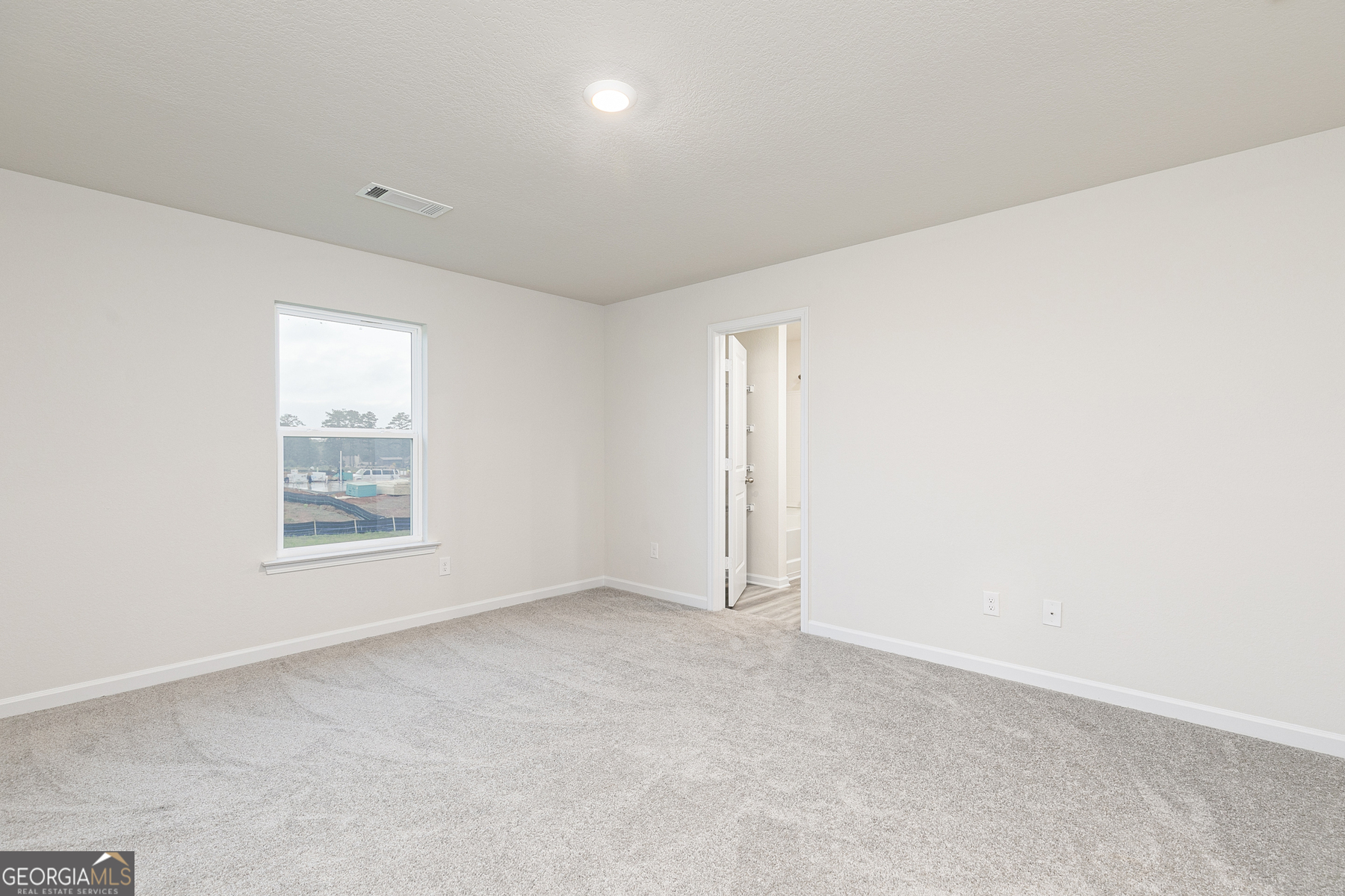 628 Slate Road Conyers, GA 30013 - Photo 16 of 25 an empty room with a window