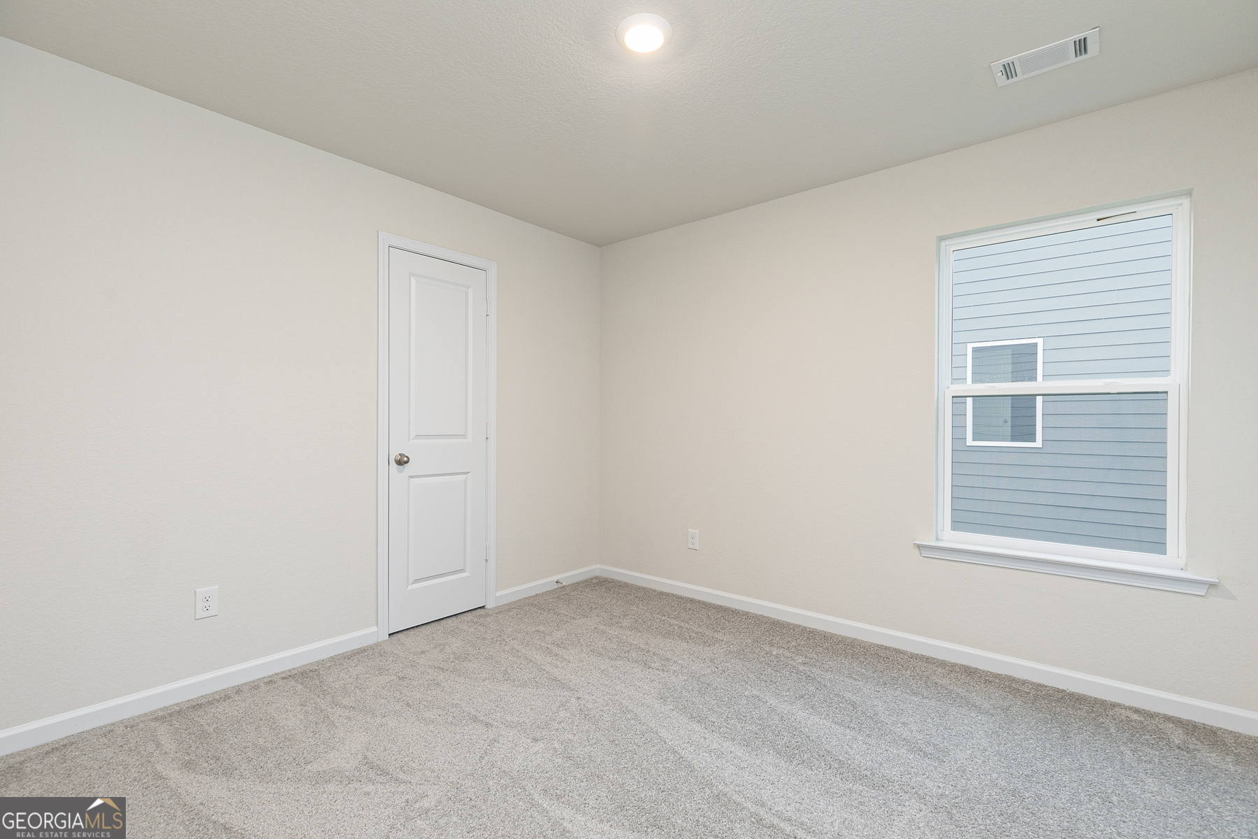 628 Slate Road Conyers, GA 30013 - Photo 22 of 25 an empty room with a window