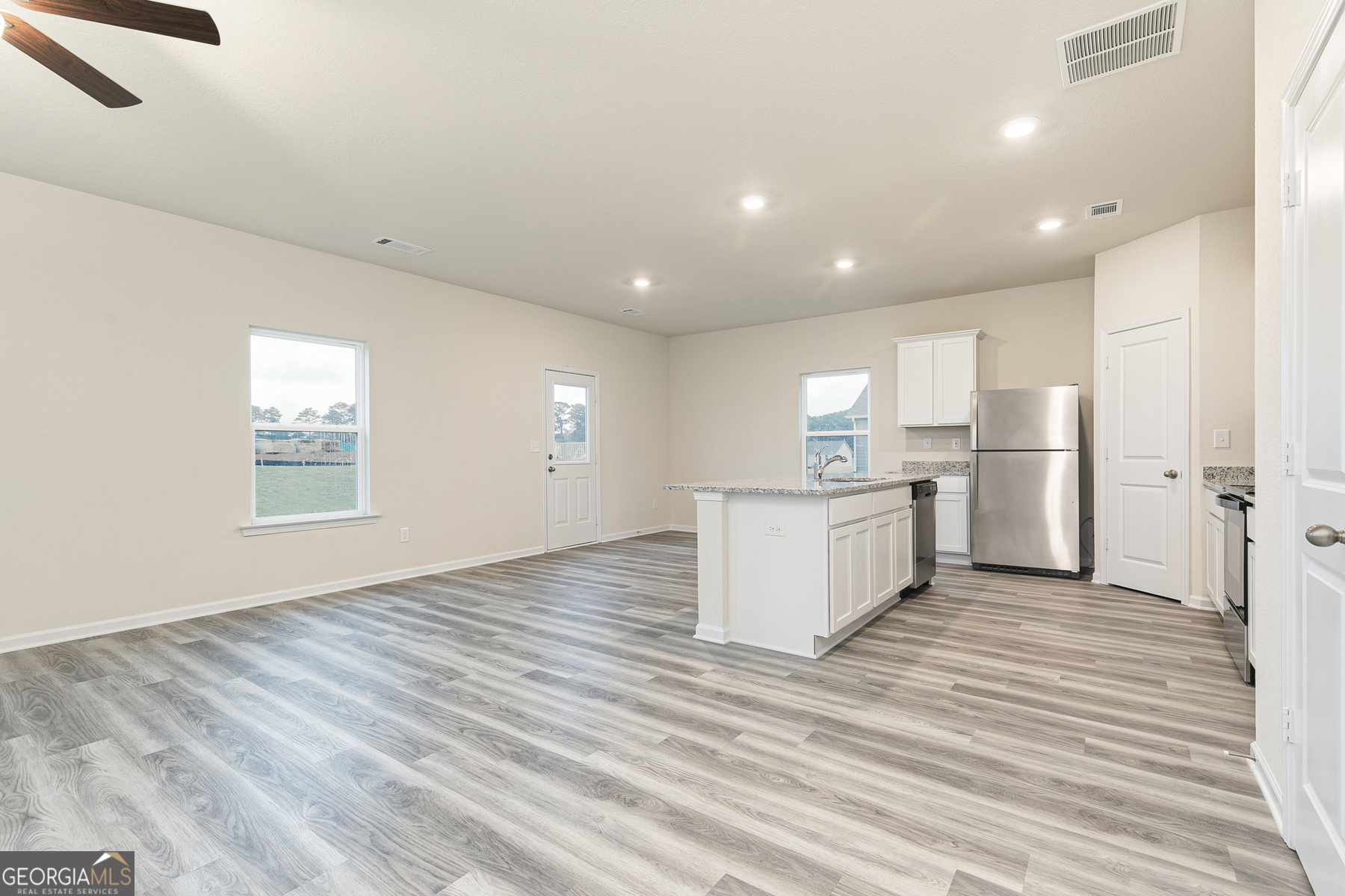 628 Slate Road Conyers, GA 30013 - Photo 5 of 25 a view of kitchen with wooden floor
