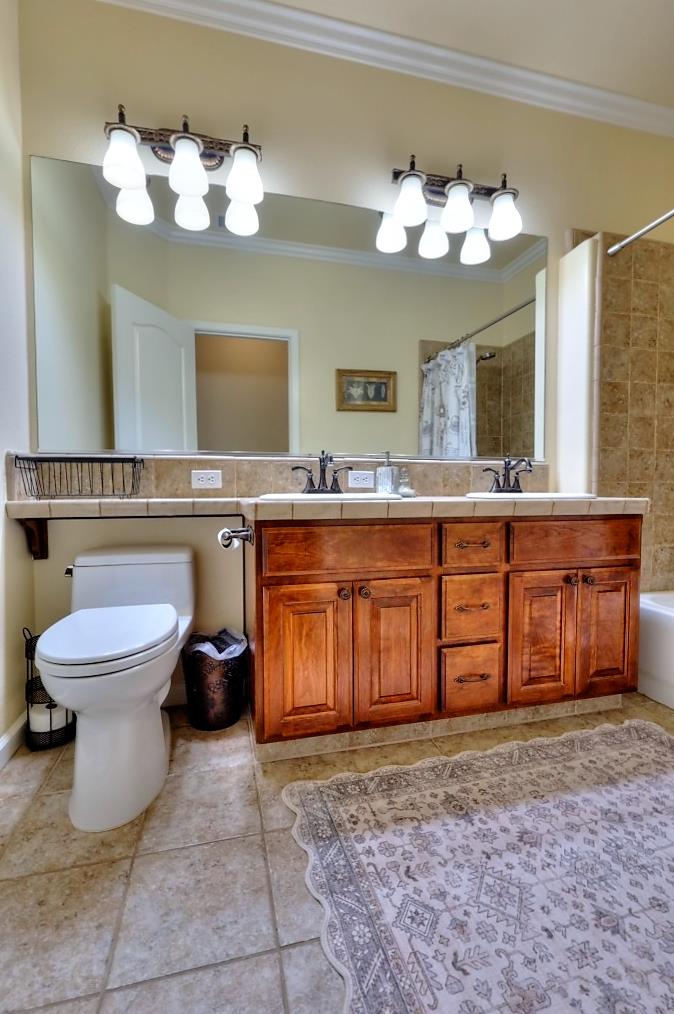 4152 Post Oak Drive Turlock, CA 95382 - Photo 46 of 71 a spacious bathroom with a sink and a mirror