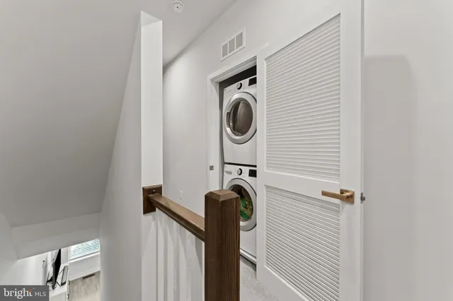 a close view of a utility room with dryer and washer