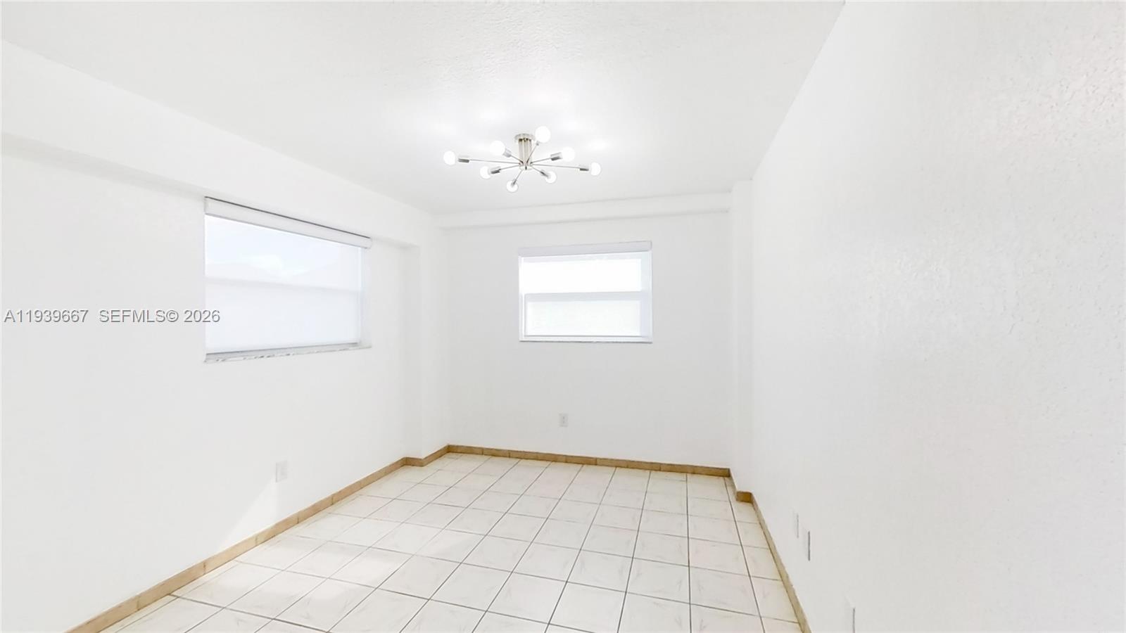 199 Southwest 12th Avenue, Unit 313E Miami, FL 33130 - Photo 17 of 21 an empty room with windows