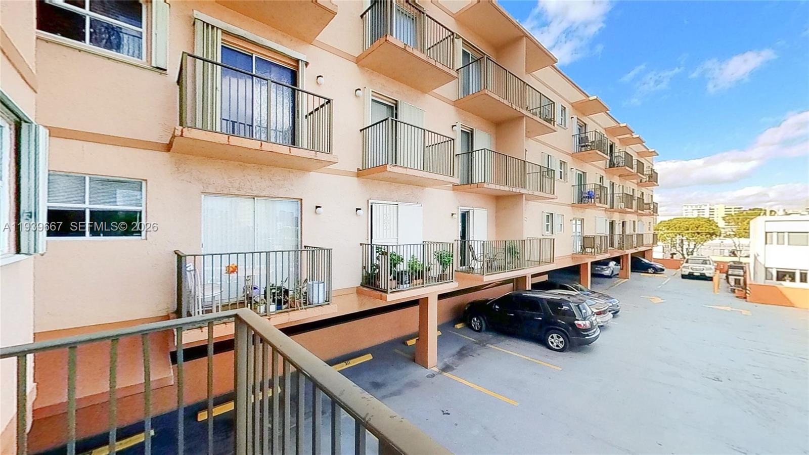 199 Southwest 12th Avenue, Unit 313E Miami, FL 33130 - Photo 18 of 21 a view of a building with cars