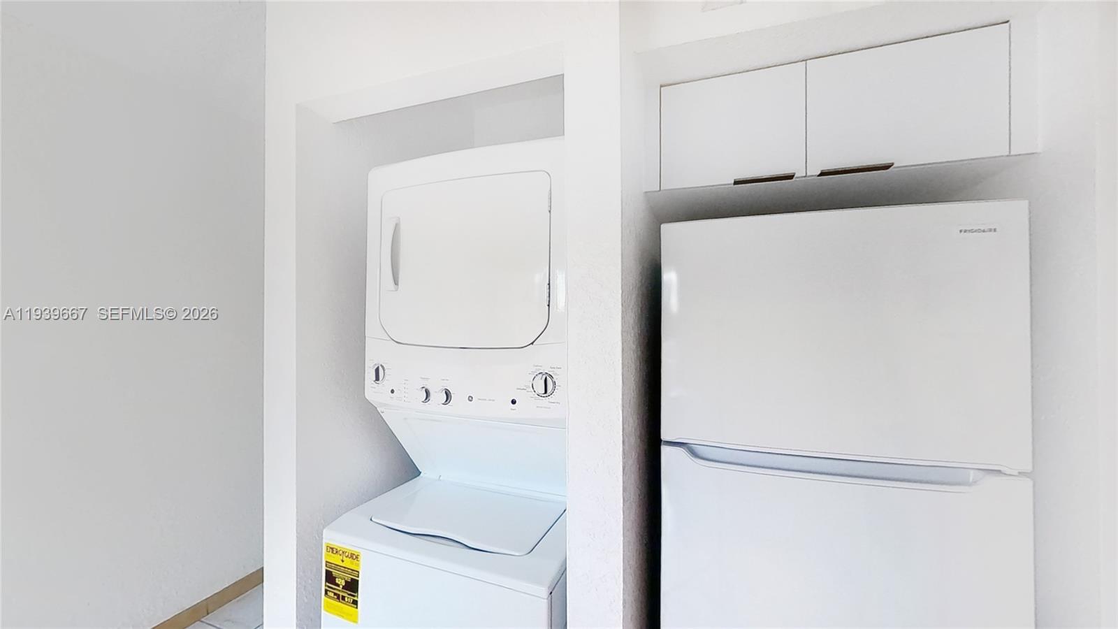 199 Southwest 12th Avenue, Unit 313E Miami, FL 33130 - Photo 4 of 21 a utility room with dryer and washer