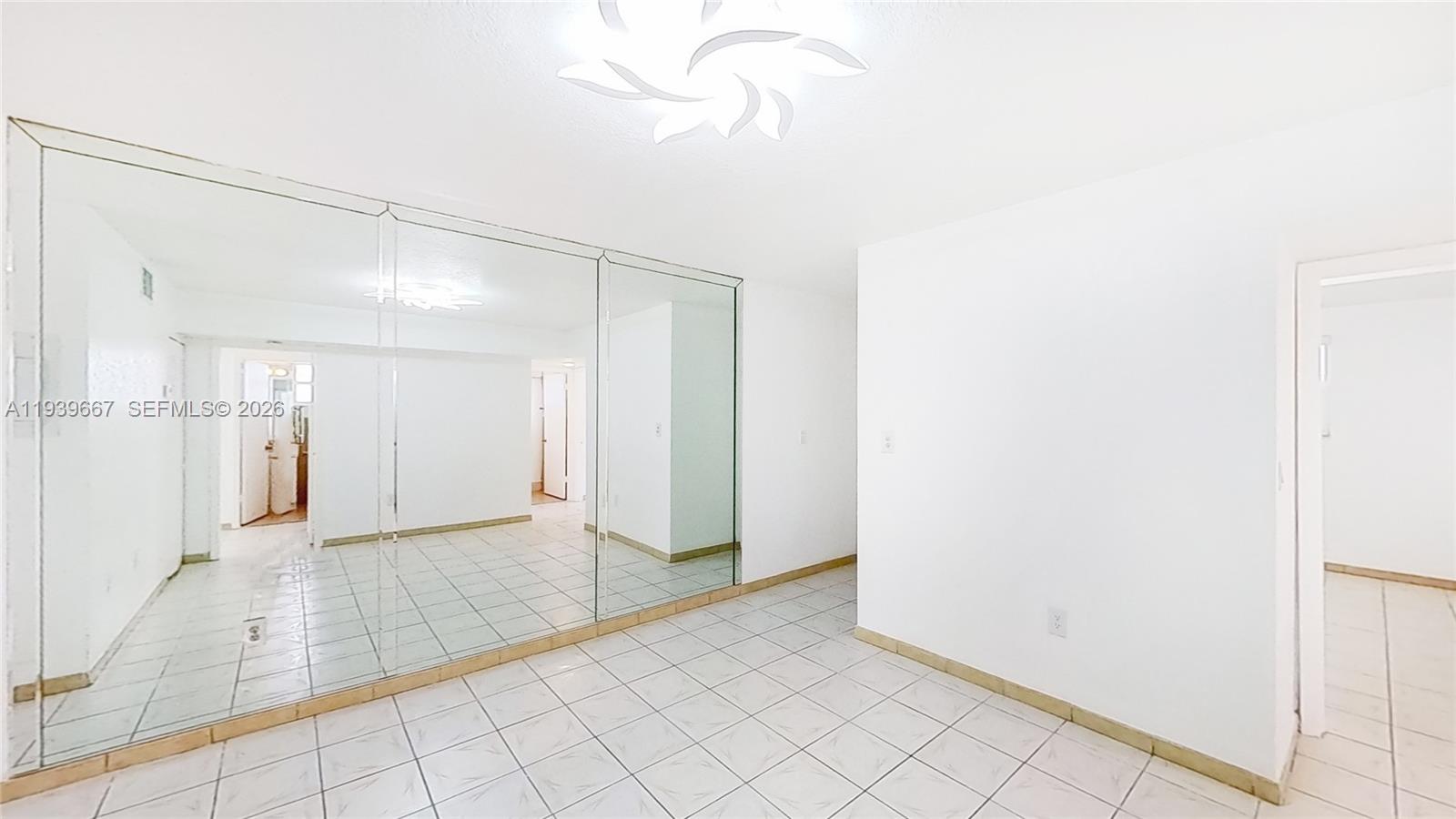 199 Southwest 12th Avenue, Unit 313E Miami, FL 33130 - Photo 5 of 21 a view of a hallway with wooden floor