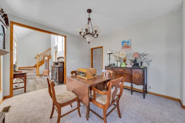 a dining room with furniture and window