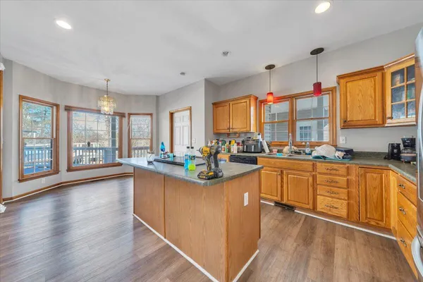a kitchen with stainless steel appliances a stove top oven and a refrigerator