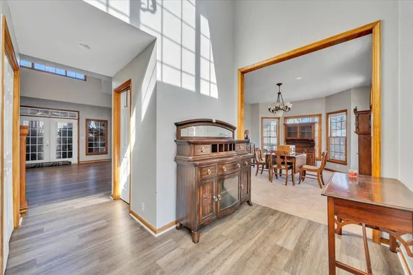 a view of a livingroom with furniture and hardwood floor