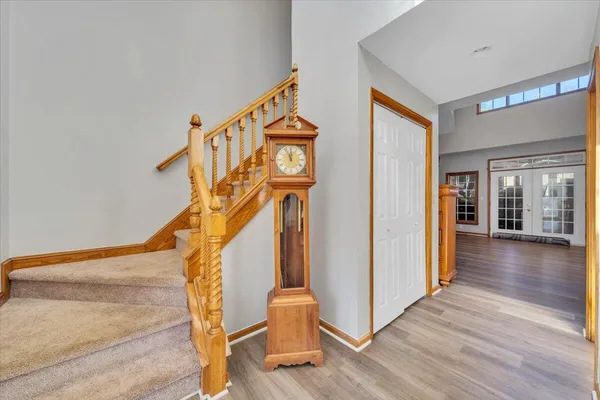 a view of entryway and hall with wooden floor