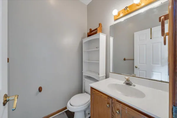 a bathroom with a sink toilet and vanity