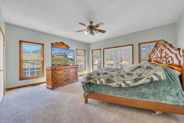 a bedroom with a bed and a couch