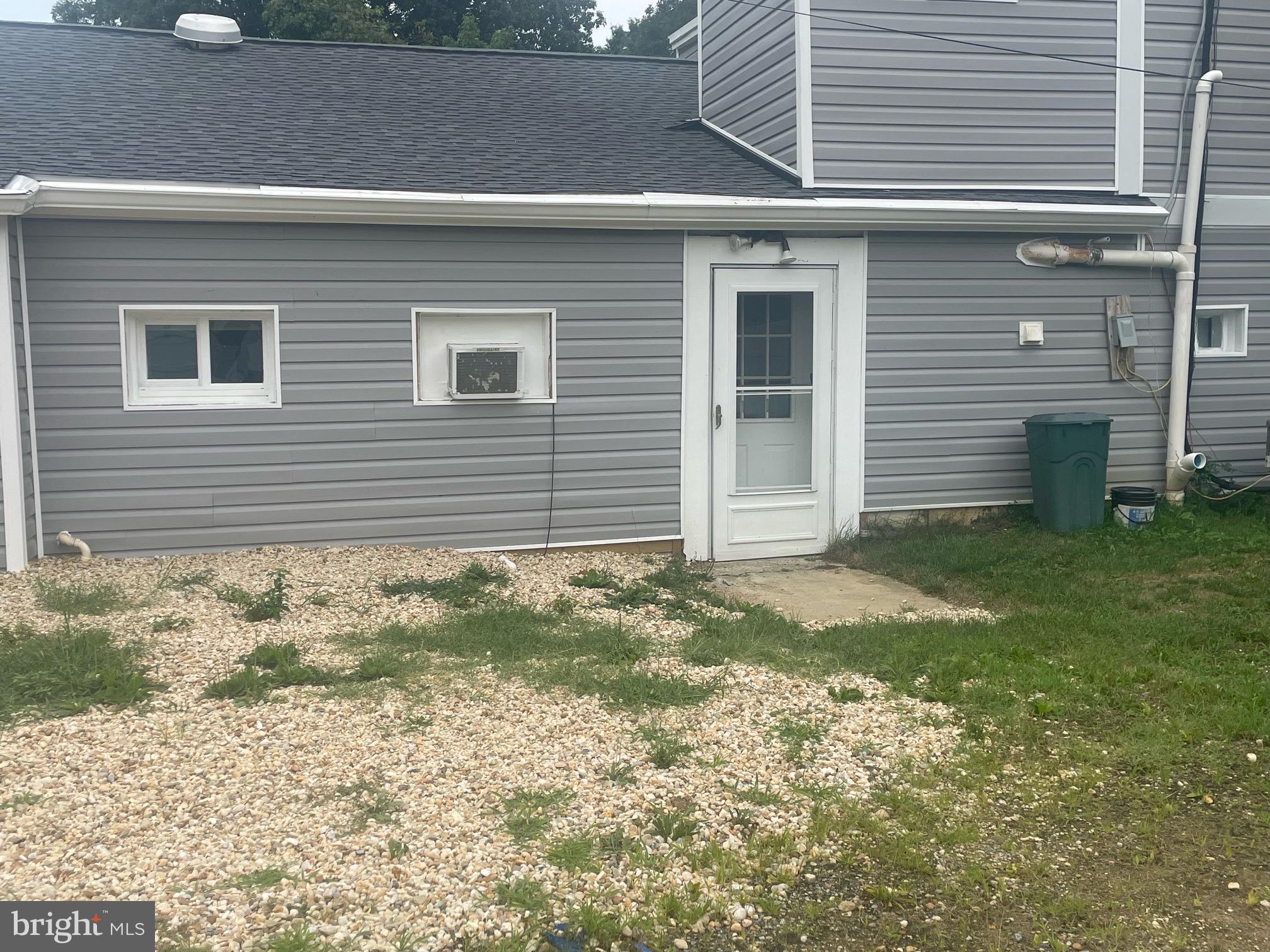 a view of front door and small yard