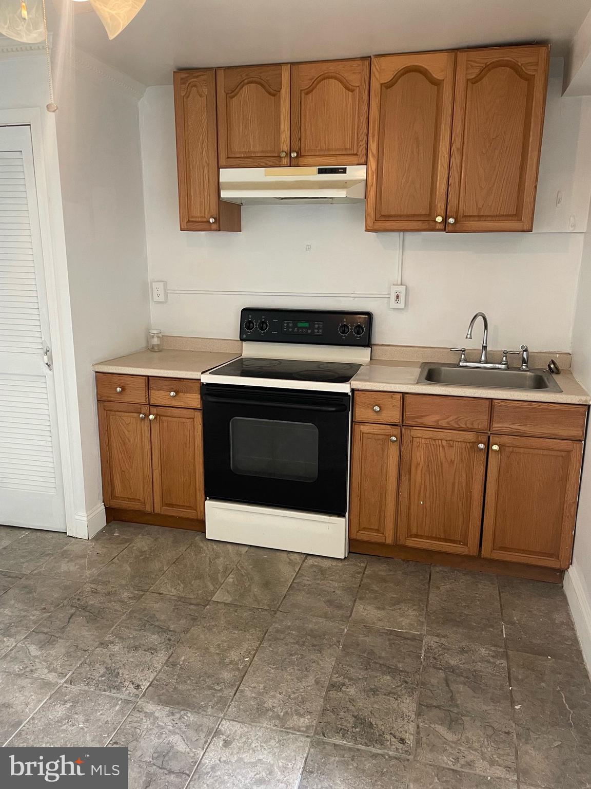 5455 Mason Springs Road, Unit D Indian Head, MD 20640 - Photo 4 of 9 a kitchen with stainless steel appliances granite countertop a stove sink and cabinets