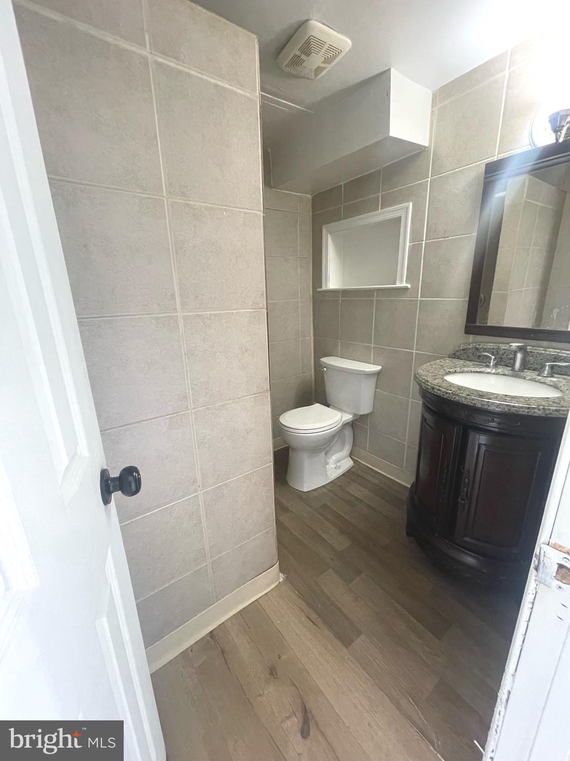 5455 Mason Springs Road, Unit D Indian Head, MD 20640 - Photo 5 of 9 a bathroom with a sink toilet and shower