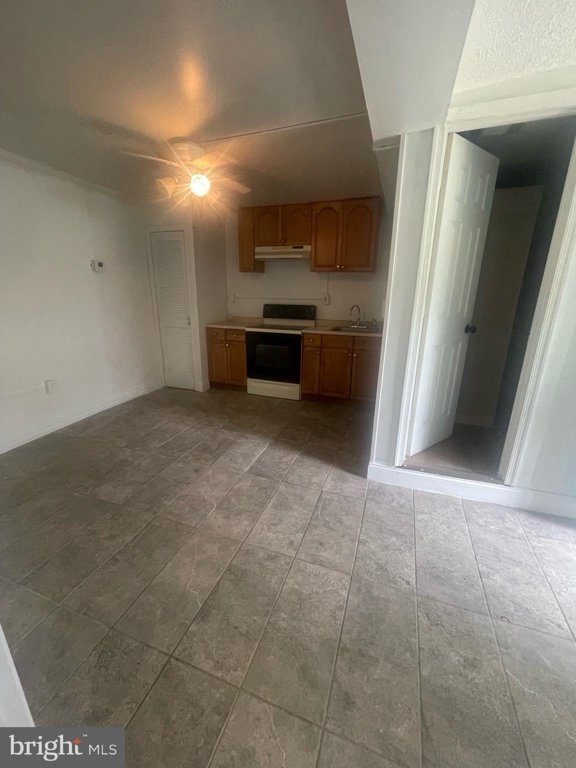 5455 Mason Springs Road, Unit D Indian Head, MD 20640 - Photo 9 of 9 a view of a kitchen with a sink and a stove top oven