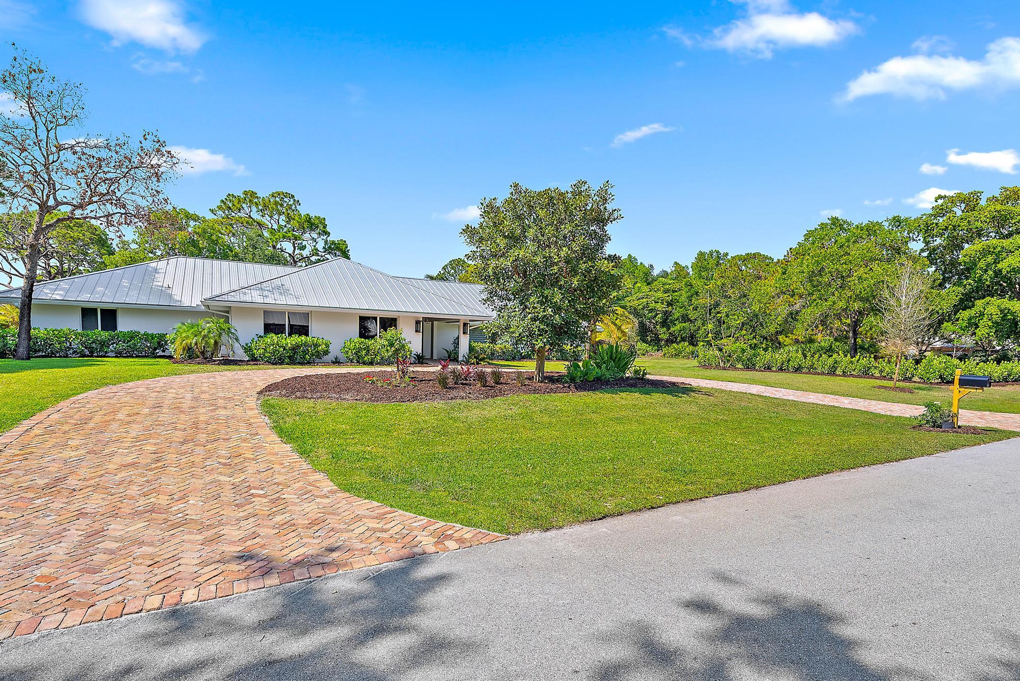6799 Imperial Woods Road Jupiter, FL 33458 - Photo 29 of 51 Front Exterior