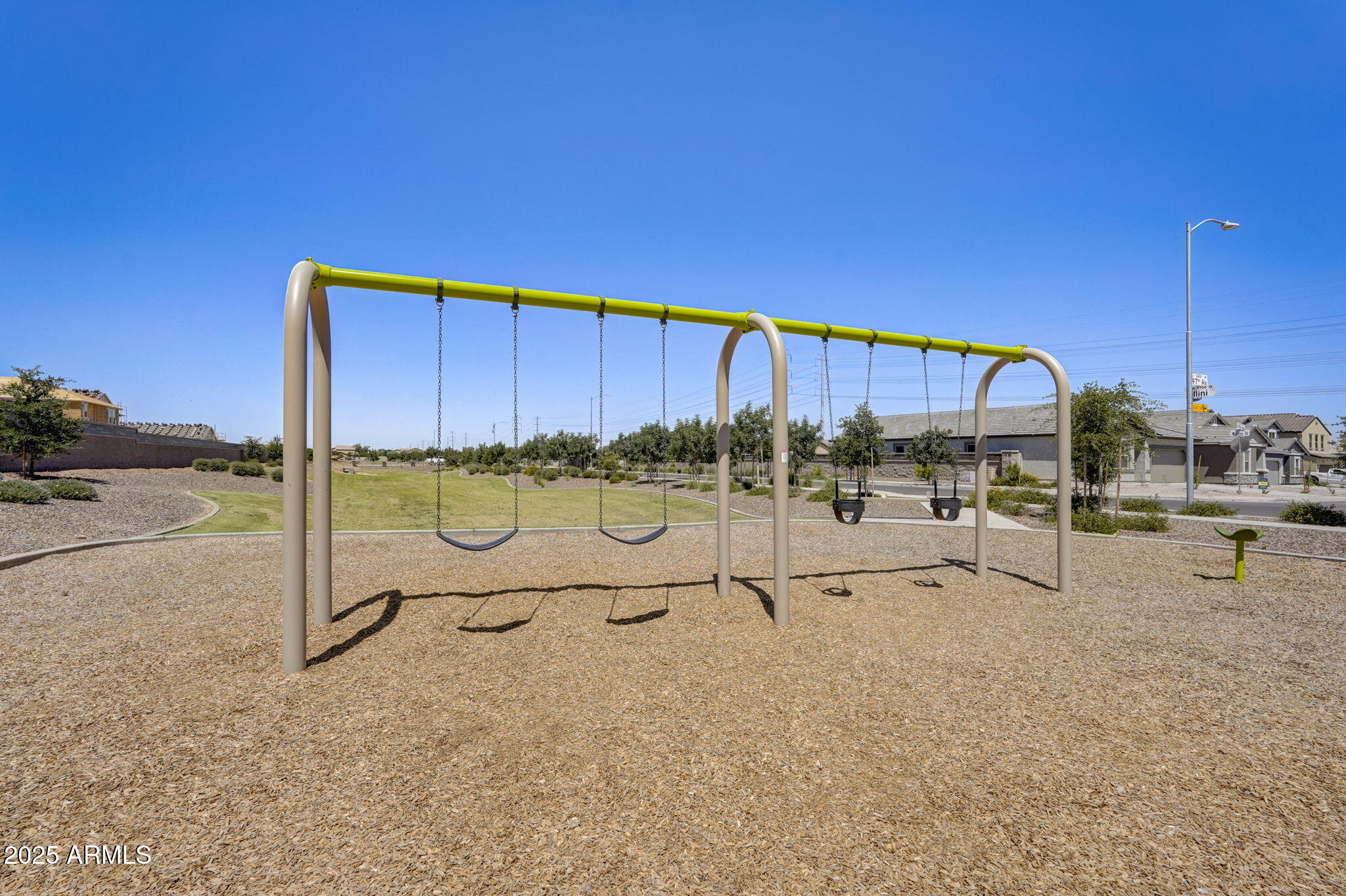 9843 West Albeniz Place Tolleson, AZ 85353 - Photo 10 of 18 a view of a tennis court