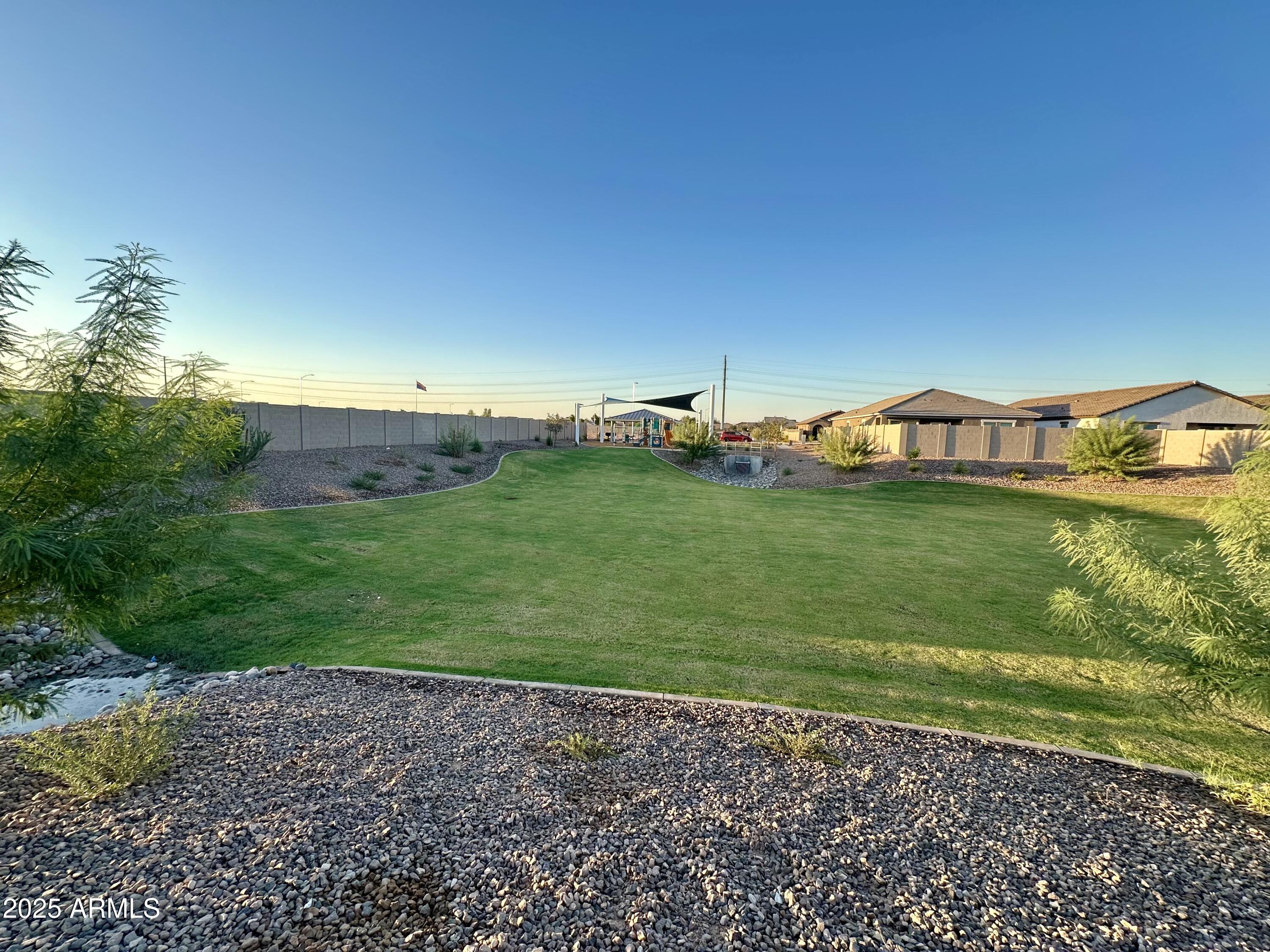 9843 West Albeniz Place Tolleson, AZ 85353 - Photo 7 of 18 a view of a yard with an outdoor space