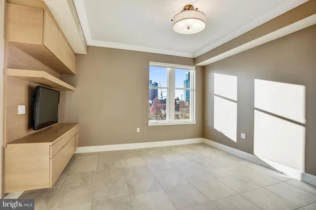 a view of an empty room with a window