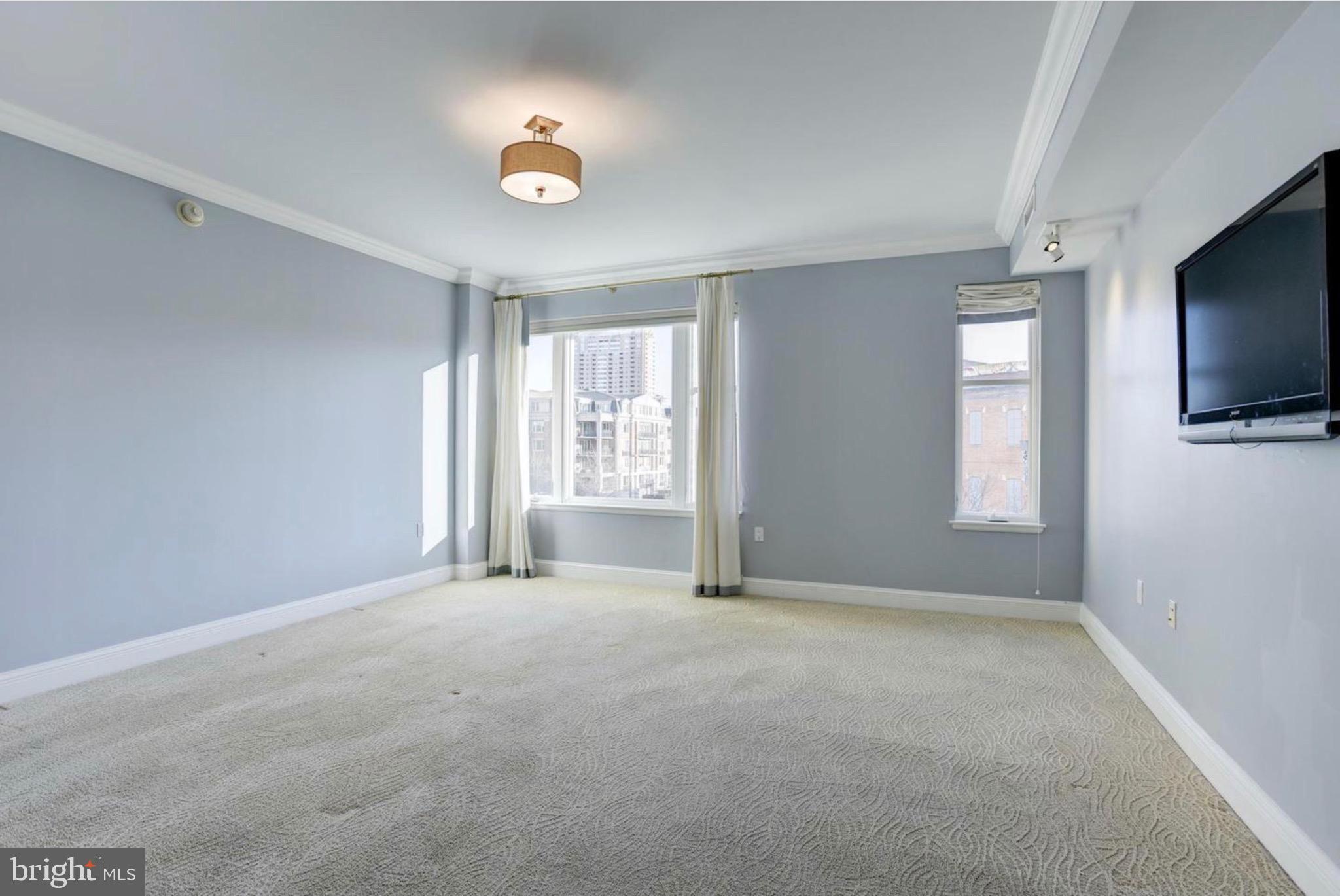 801 Key Highway, Unit 413 Baltimore, MD 21230 - Photo 23 of 40 a view of an empty room with a window