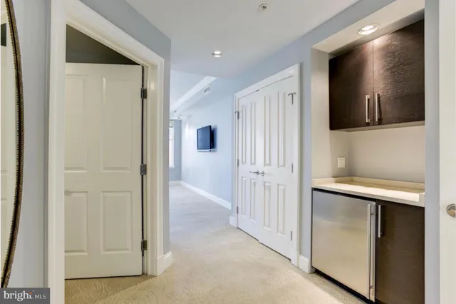 a view of a hallway with two rooms