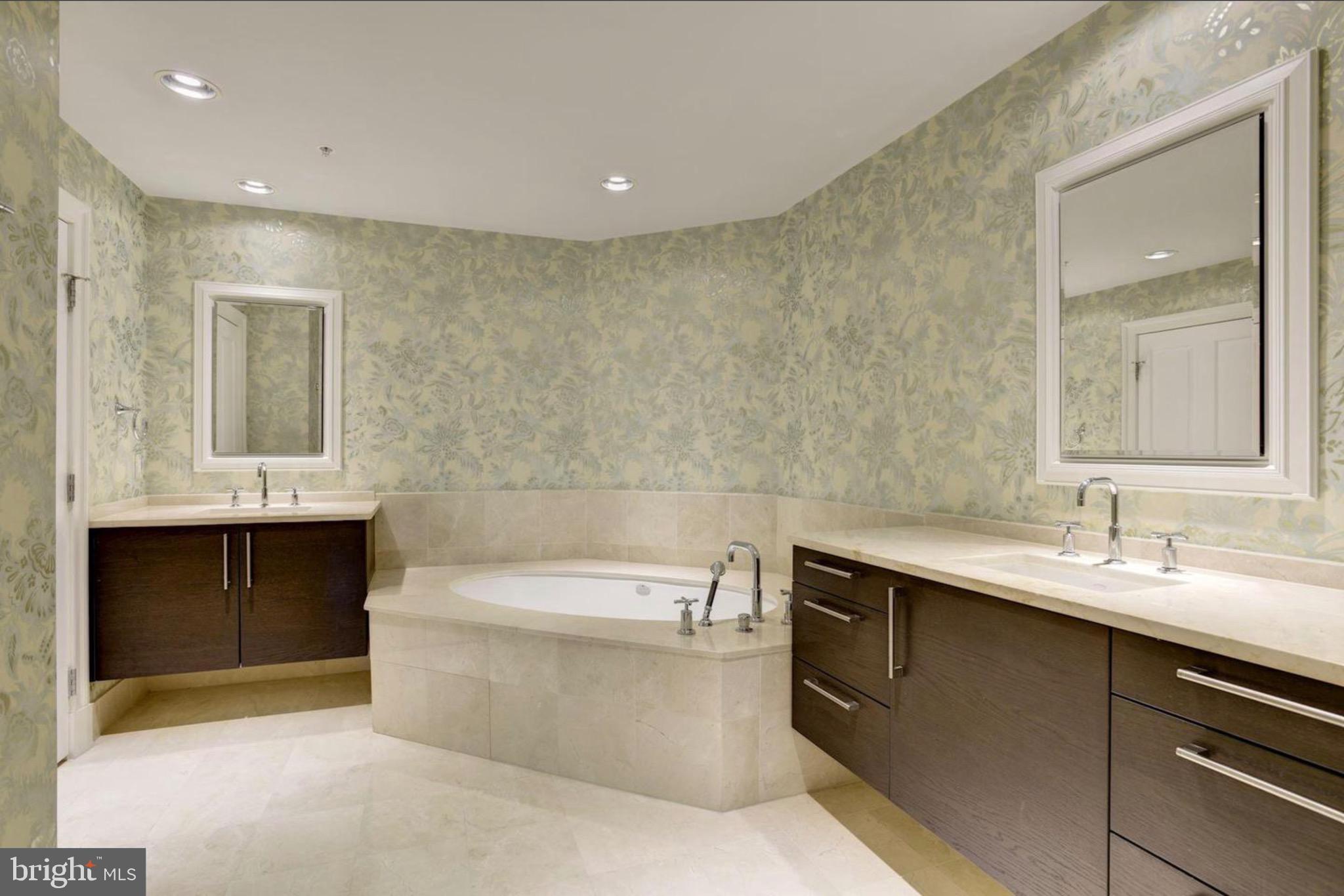 801 Key Highway, Unit 413 Baltimore, MD 21230 - Photo 26 of 40 a bathroom with a bathtub and a sink