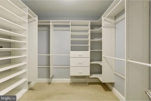 a view of an empty room with empty shelves
