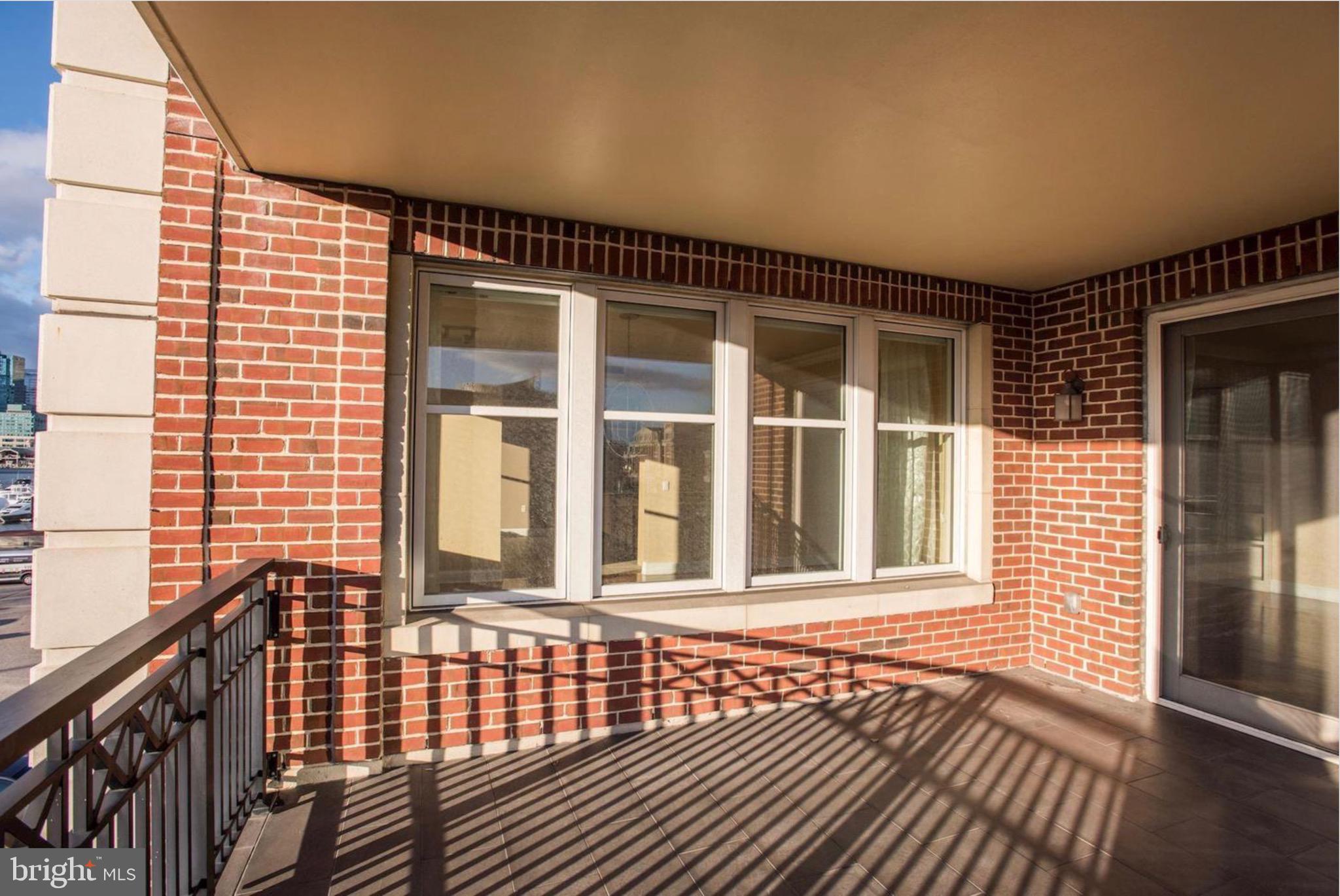 801 Key Highway, Unit 413 Baltimore, MD 21230 - Photo 36 of 40 a view of a brick house with wooden floor