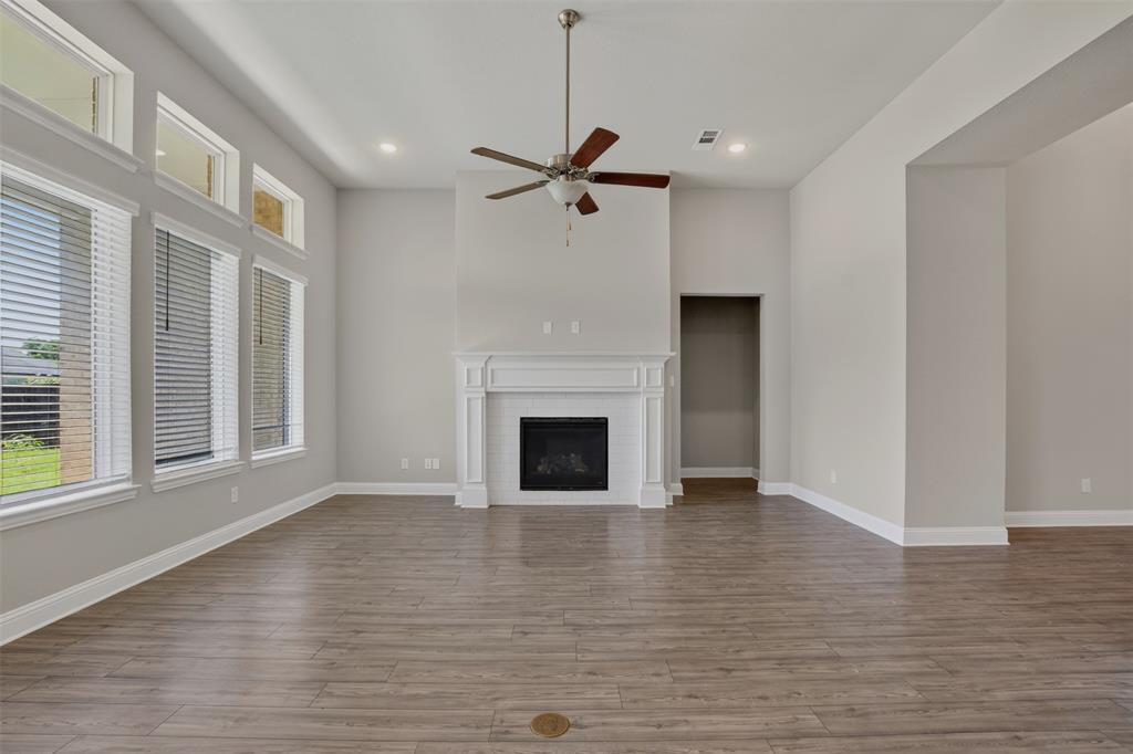 16812 Bitterroot Road Justin, TX 76247 - Photo 19 of 27 a view of a livingroom with a fireplace and window