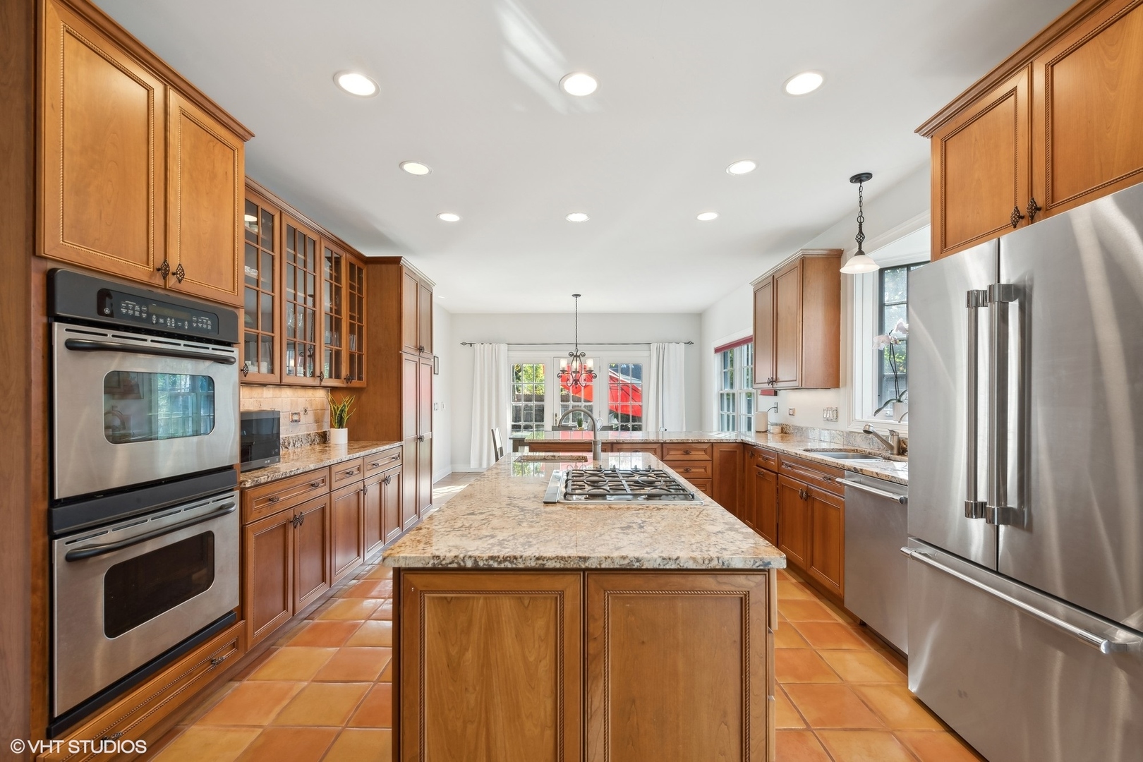 617 Hillside Road Glenview, IL 60025 - Photo 12 of 40 a kitchen with stainless steel appliances granite countertop a refrigerator a stove top oven a sink and dishwasher