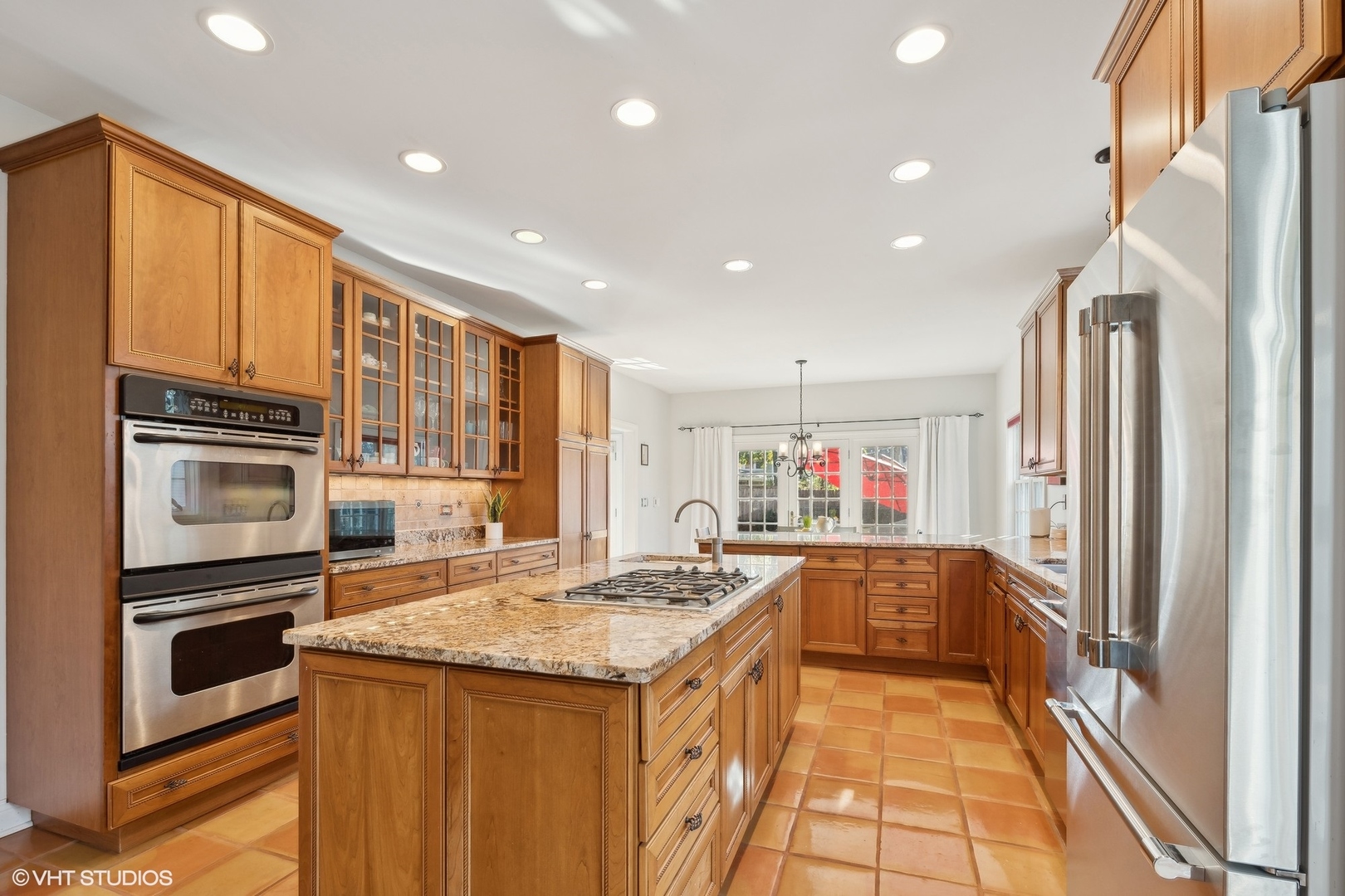 617 Hillside Road Glenview, IL 60025 - Photo 13 of 40 a kitchen with stainless steel appliances granite countertop a refrigerator and a stove top oven