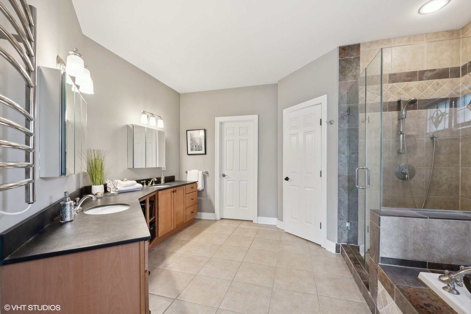 617 Hillside Road Glenview, IL 60025 - Photo 15 of 40 a large bathroom with a granite countertop sink a toilet a mirror and shower