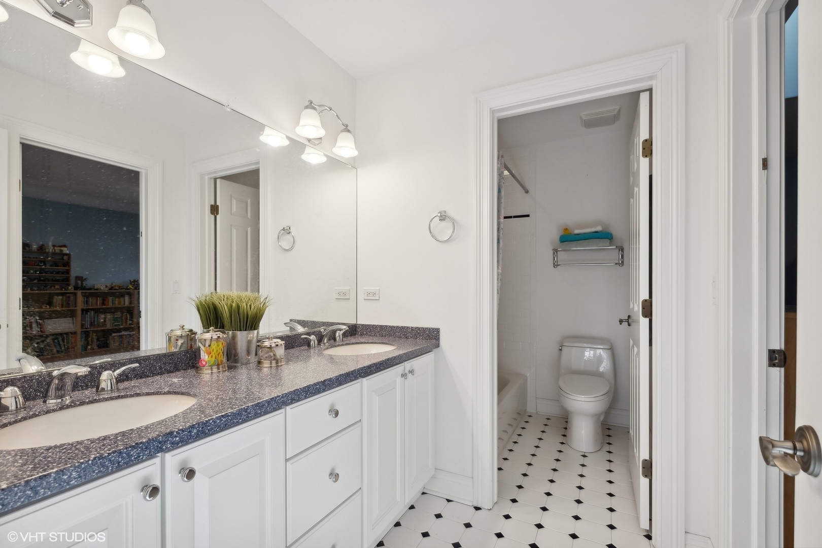 617 Hillside Road Glenview, IL 60025 - Photo 26 of 40 a bathroom with a sink a toilet and a mirror