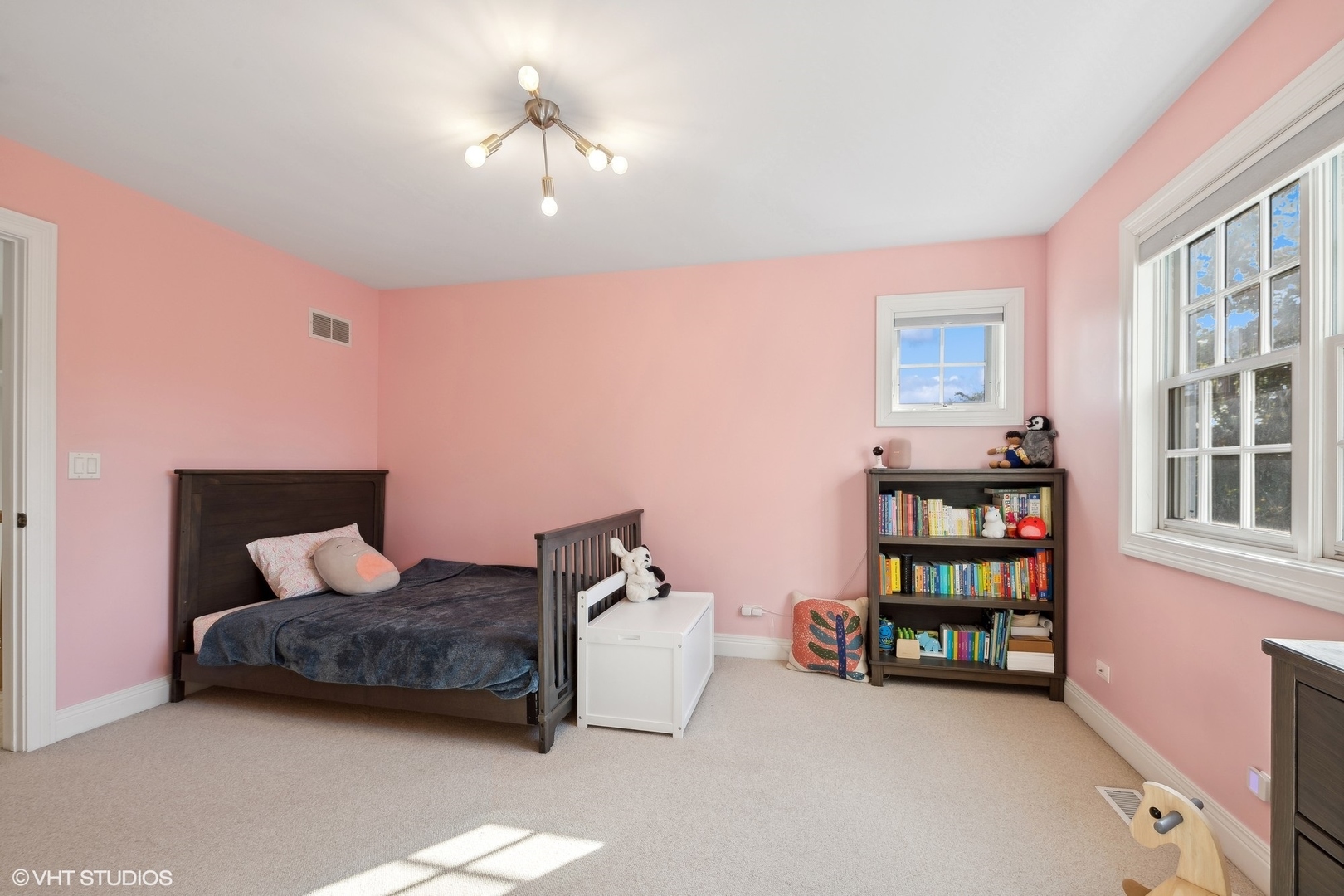 617 Hillside Road Glenview, IL 60025 - Photo 27 of 40 a bedroom with furniture and a chandelier