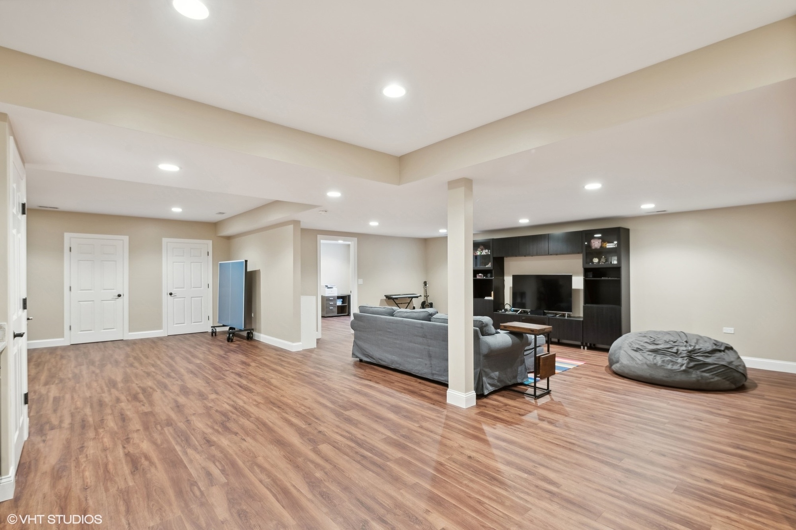 617 Hillside Road Glenview, IL 60025 - Photo 28 of 40 a view of living room kitchen with furniture and flat screen tv