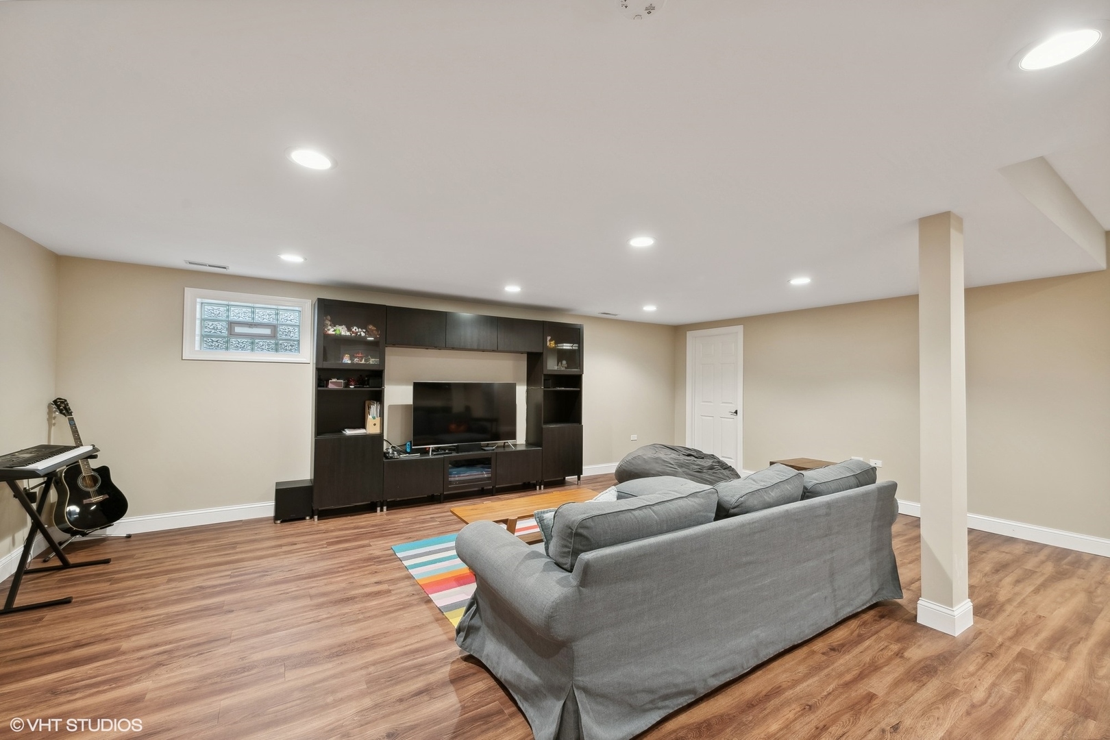 617 Hillside Road Glenview, IL 60025 - Photo 30 of 40 a living room with furniture and a flat screen tv